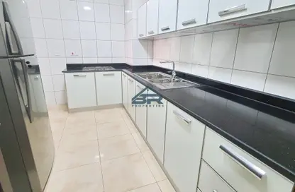 Kitchen image for: Apartment - 2 Bedrooms - 2 Bathrooms for rent in Exhibition Road - Hoora - Capital Governorate, Image 1